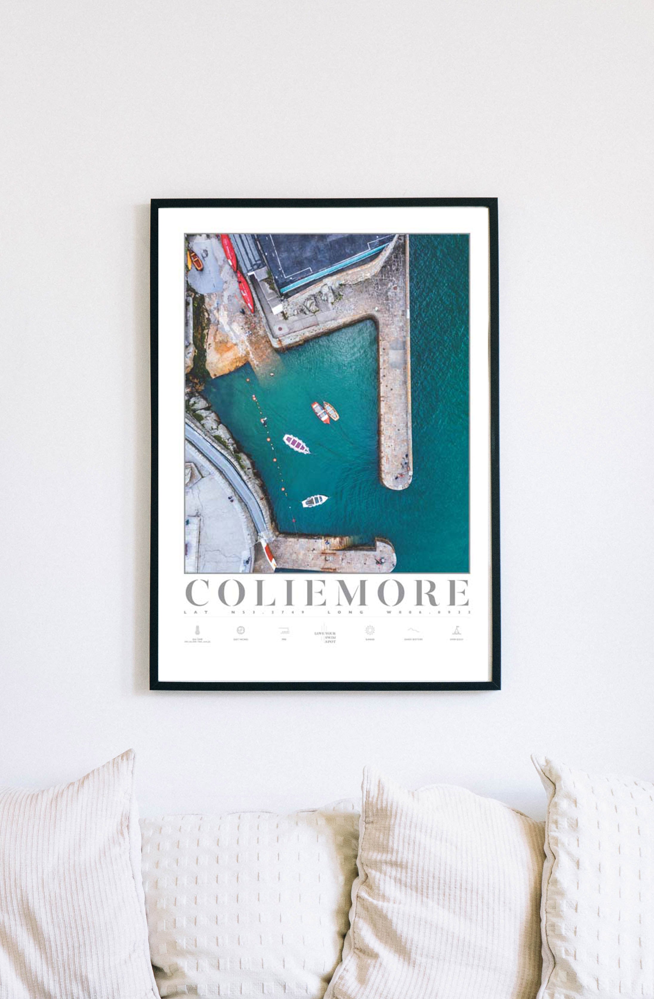 Love Your Spot print of Coliemore Harbour hanging on a wall over four pillows