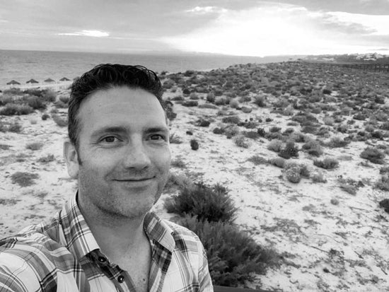 Selfie of one of the co-founders of Love Your Spot, Dermot, with a beach in the background